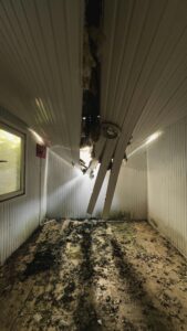 Water damage inside a residential condo building showing the financial impact of insurance deductibles and emergency repair costs.